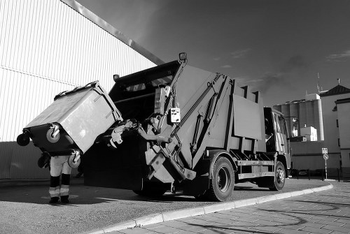 Customer service desk with staff assisting a business owner about waste collection options