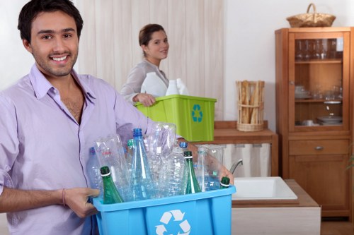 Workers sorting recyclables at a transfer station